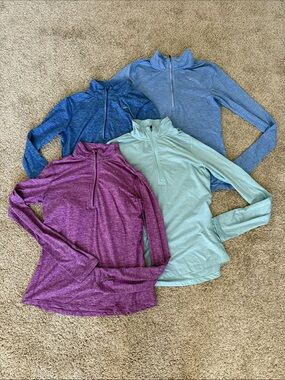 Women’s Nike 1/4 Zip Assortment Purple, Teal, Light Blue, Blue